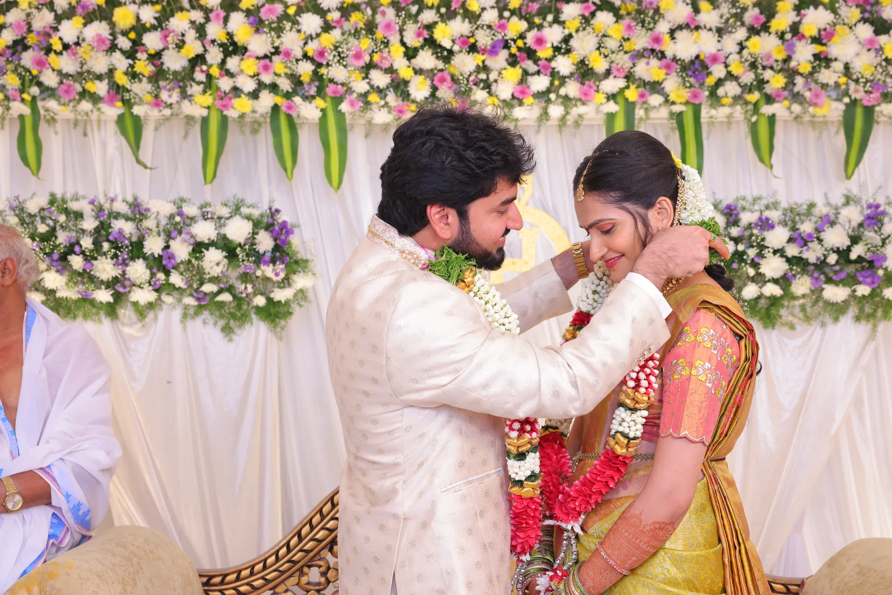 A joyful engagement garland moment